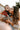 Woman kissing a baby she’s holding in her arms.